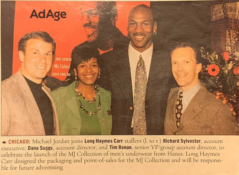 Four people posing at an AdAge event.